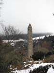 SX02588 Round Tower Glendalough in snow.jpg